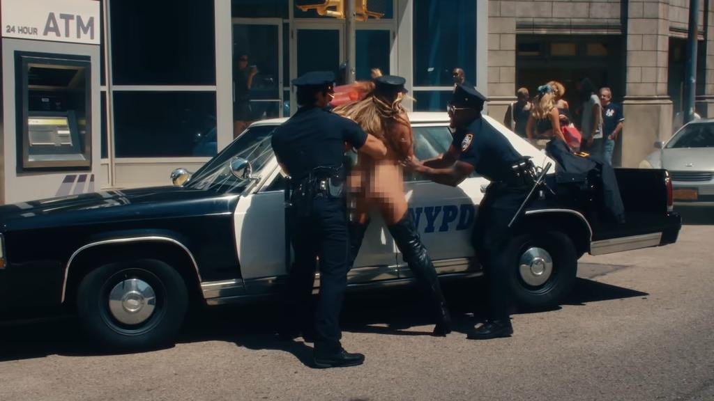 Tate McRae gets arrested while naked in her new music video