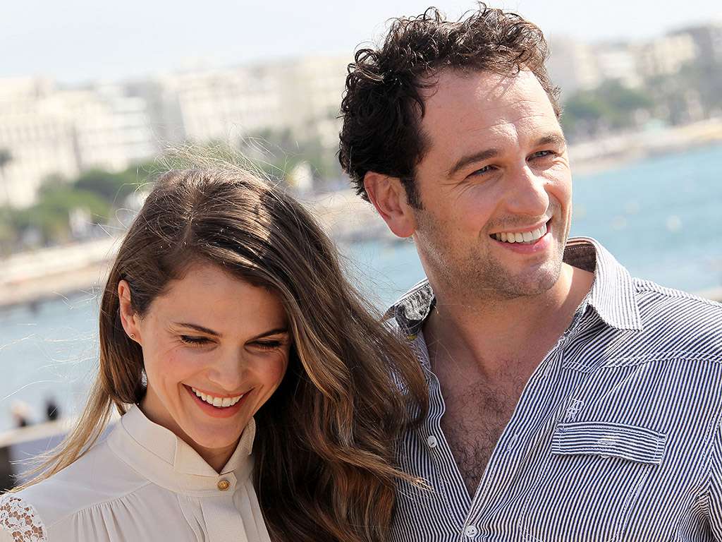 Matthew Rhys and Keri Russell appearing together at a high-profile awards event.