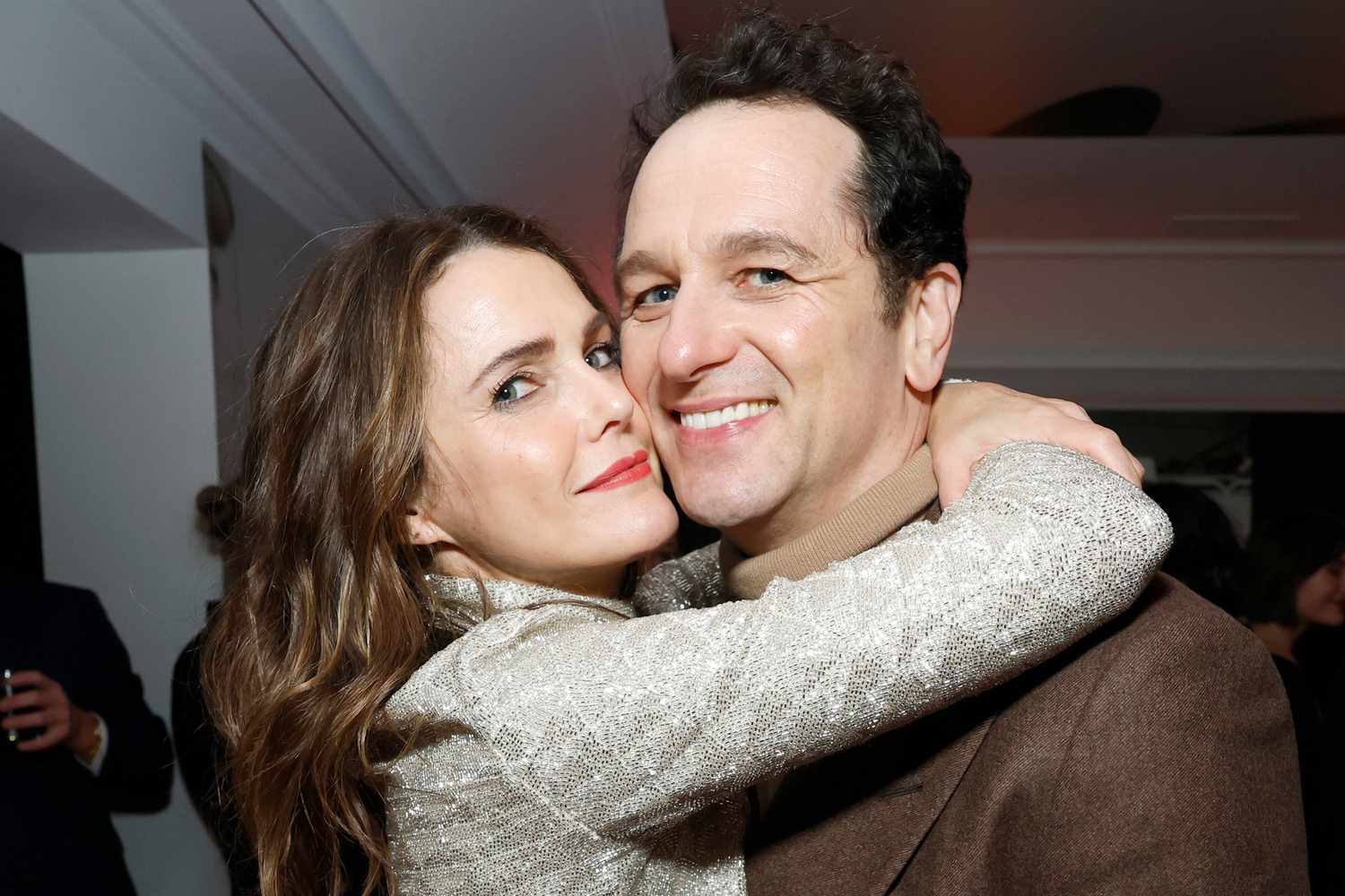 Matthew Rhys and Keri Russell appearing together at a high-profile awards event.