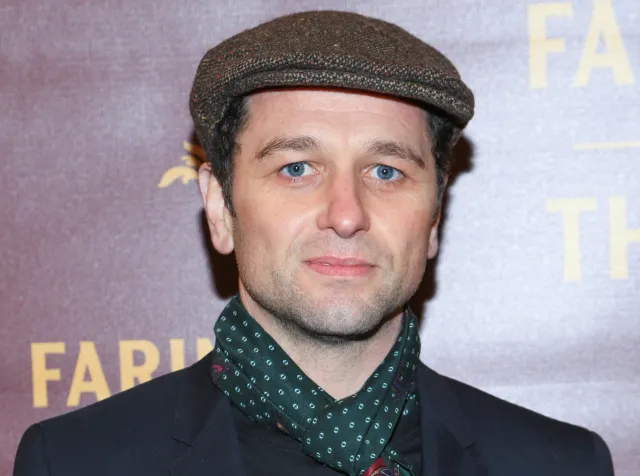 Matthew Rhys holding two Emmy Awards at the 2026 ceremony.