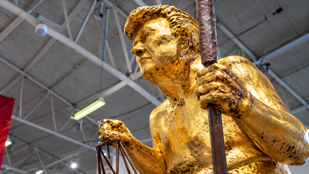 orange plague trump statue